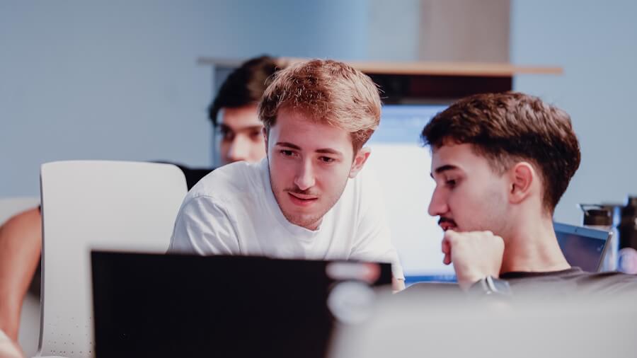 First-year Inteli students collaborating on artificial intelligence projects